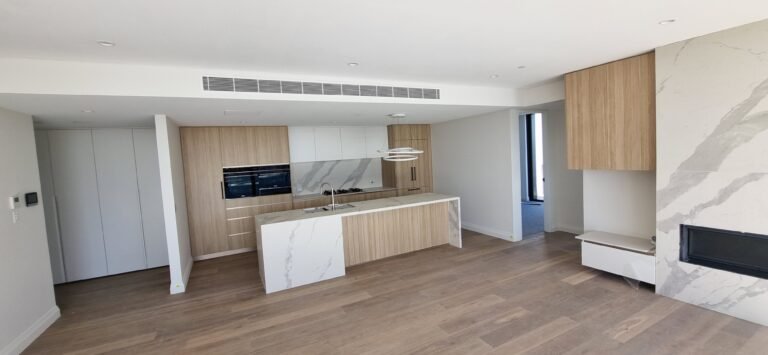 Modern apartment interior with newly installed Daikin ducted air conditioning system, Alexander Street, Crows Nest.
