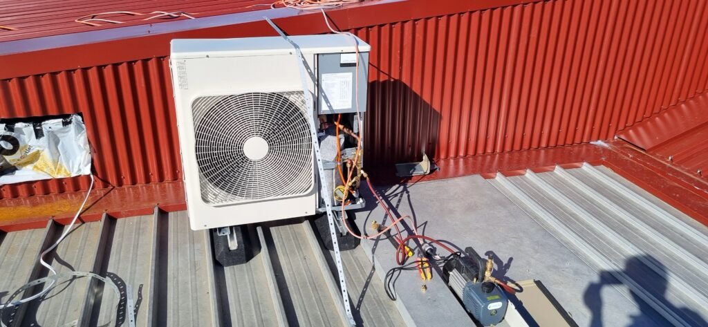 Toshiba outdoor air conditioning unit and ventilation exhaust system installed on the rooftop of St Margaret Mary’s Primary School